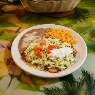 G. Two beef Enchiladas, one tamale and one beef taco